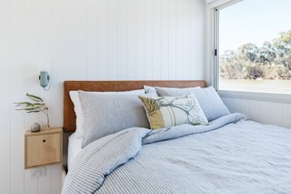 Bedrooms capitalize on river views and built-in storage.