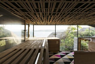 The interior walls are solid oak layered with a natural sawn texture, while the acoustic ceiling is covered with woven oak strips.