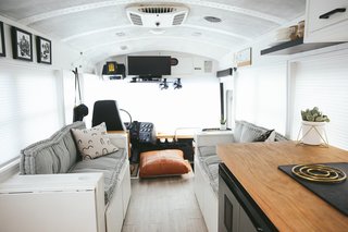 Above is a look at the living area. The couches can seat the entire family, and can also be converted into a full bed, if needed. There is storage in the bases of the couch and a shoe shelf by the front door. "This has been such a blessing and has helped us to keep the bus organized," the Mayes Team explains.