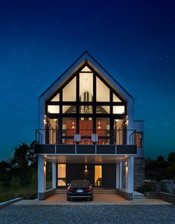 The client can enjoy the outdoors day or night via the screened porch and deck.