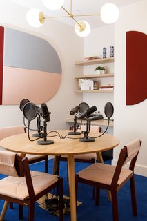 The podcast room includes the Alto Compass chandelier from Cedar & Moss.
