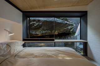 An Arresting Australian Abode by Glenn Murcutt Needs a Buyer - Photo 7 of 8 - The rock ledge provides natural privacy from the street and ensconces occupants in the site's beauty.