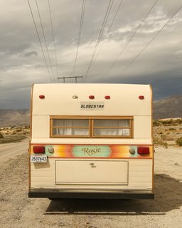Starting with the exterior, the couple tweaked the original scheme by spraying the body of the trailer with a cream base color, then commissioned artist Faye Bell to paint a playful Southwest-inspired stripe.