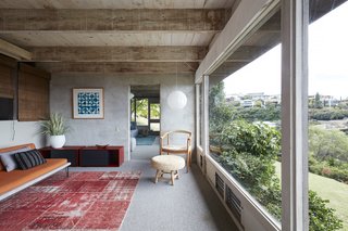 A wall of glass offers views to a flex room.