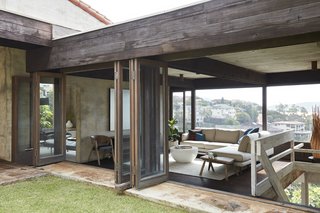 Folding doors make it easy for breezes to blow through the house and cool it naturally.