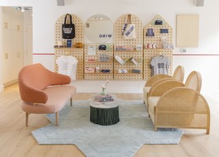 In the reception area, the Arch Chair from father-and-daughter New Zealand makers Douglas and Bec sits atop the Sky Swizzle Honeycomb area rug from Kinder Modern. Although there are multiple clusters of seating to encourage collaboration, members are also offered numerous private nooks for solitary work. 