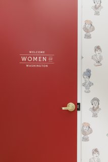 A red door at the entry welcomes members.
