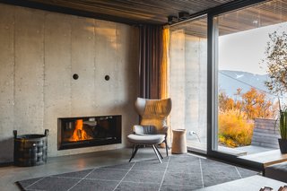 A cozy corner of the living room has access to a south-facing outdoor area where the family enjoys dinner on warm summer days.