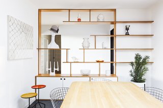 Horner replaced the dysfunctional, closed storage with custom, open shelving that now connects the kitchen to the entry, increasing natural light and sightlines around the house.