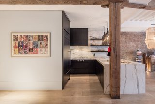 The cabinets are topped with stone—Calacatta Borghini from ABC Stone—which waterfalls to the floor and sheaths the backsplash for a seamless look. "We worked alongside the fabricator to align the veins of the stone to create a fluid move," explains Coffey. Appliances include a Gaggenau range top, steam and convection oven, as well as a walk-in pantry with two drawer refrigerators and a wine fridge.