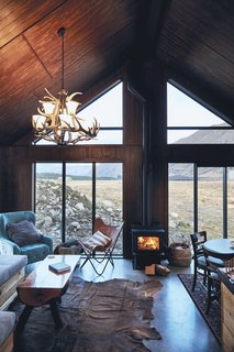 "With this cabin I wanted something that was robust, so you could enter after an outdoor activity, kick your boots off, start the fire, and put some food on," explains Kenny. "But at the same time, have a feeling of space with the high ceilings, and some luxury and comforts of modern living, like a nice shower and great water pressure."