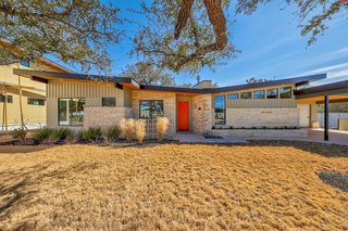 Priced at $419,9000, The Cocoa Beach is a three-bedroom, two-and-a-half-bath residence of 1,560 square feet. It boasts a striking butterfly standing-seam metal roof and exterior stonework.