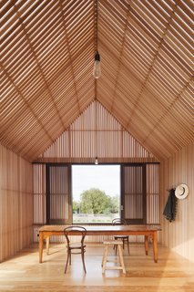 In the homeowners' previous beach cottage, they had a table by the window from which they could talk to neighbors on the street. The architects made sure to recreate that here. "An important aspect of this room is its direct and engaging relationship with the streetscape and the important social aspect of communicating with people passing by on foot," say the architects.