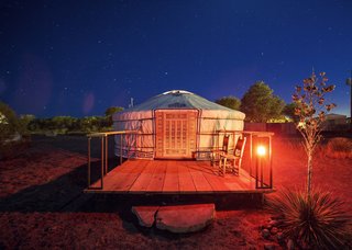 Here is a look at the exterior of a yurt with a bespoke door.