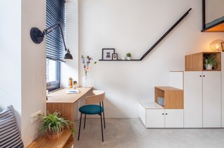 The stair railing becomes a picture ledge.