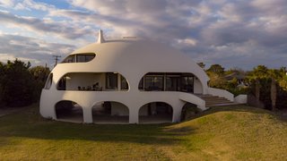 The "Eye of the Storm" sits on a .48-acre lot fronting the beach, only 230 feet from the water.