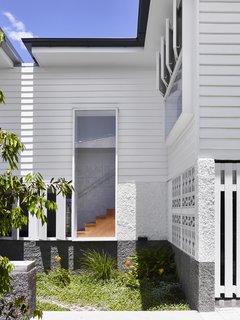 A view of the stairs through a window in the courtyard.