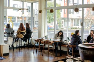Lots of windows bring in lots of natural light at Dapper & Wise Coffee Roasters.