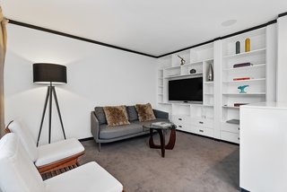 A study/media room lies adjacent to the kitchen.