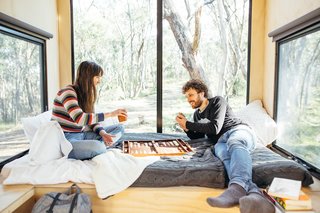 A king-size mattress occupies one end of the cabin, making for a comfortable sleeping spot for two, as well as a relaxing lounge area during the day.
