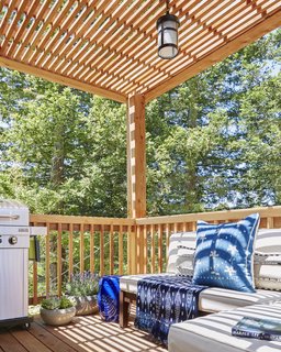 Hefty redwood timbers support the structure and frame views of the surrounding trees.