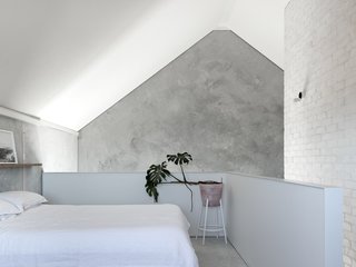 The mezzanine level hosts the bedroom.