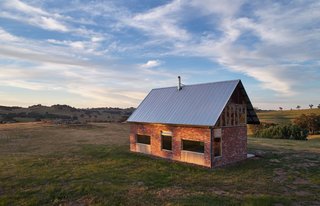 Passive design principles were utilized in the siting of the highly-insulated cabin. Deep eaves protect the interior from hot summer sun, while a verandah overhang optimizes solar gains in winter.