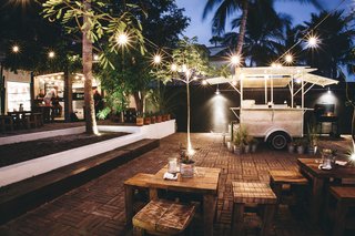 The food cart specializes in smoked meat sandwiches. It sits on a patio event space that can hold up to 300 people with seating for 80.