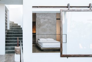 A 215-square-foot room tucked behind a rolling glass window.