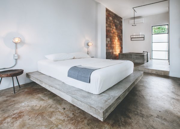 A 270-square-foot guest room includes a poured concrete tub with a rainhead shower.
