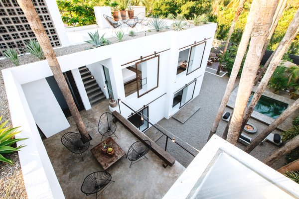 All of the rooms overlook a central courtyard filled with Palm trees.
