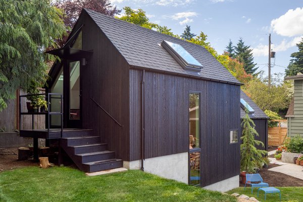 The architects expanded the building to a total of 571 square feet. The rear entry, shown here, accesses a loft space that is currently used for storage. In the future, the loft might become an office or additional sleeping quarters, depending on the homeowners' needs.