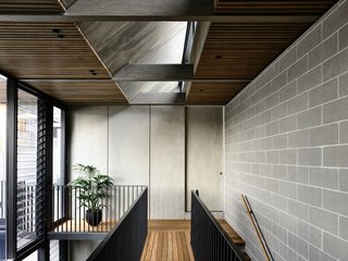 The wall and bedroom door are fashioned from a compressed fiber-cement sheet made by CSR, which is called Barestone.
