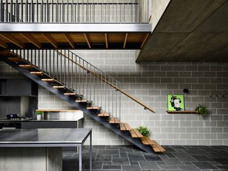 The warm wood provides a stark contrast to the cool, grey interiors.