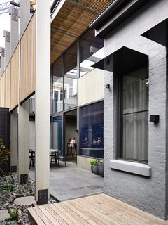 This view shows how the original house relates to the new addition, which was strategically placed to make room for an exterior courtyard.