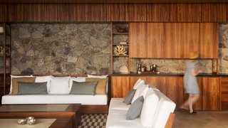 The interior stonework echoes the exterior, so that it feels as though the structure has been carved from the hillside.