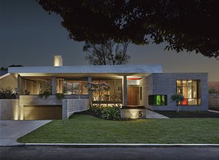 Said Cownie: "I felt a responsibility to produce a design for this new house that not only served the needs and desires of my clients but was also in conversation with the ethos of the suburb, without mimicking or replicating the past." The strong form of the street-facing facade is fashioned from board-formed concrete, and a solar array is tucked on the roof.