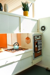 The cooktop and wall ovens are also original and still function well.
