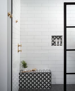 The patterned tile on the built-in shower bench is from Kerion Ceramics, and is playfully repeated in the wall niche.