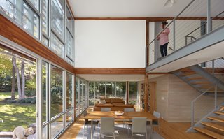 The exposed Douglas fir timber framework supports the addition.