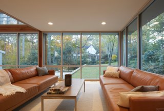 Views of the newly landscaped garden can be appreciated from two walls of glass in the living room.