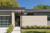 Modern home with Outdoor, Front Yard, Grass, Trees, Shrubs, Hardscapes, Walkways, and Landscape Lighting. Entry Photo 2 of Pavilion Haus