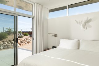 This Modern Homestead With a Vintage Trailer Offers Adventure in California's High Desert - Photo 3 of 10 - The casita sleeping area opens up to the landscape.