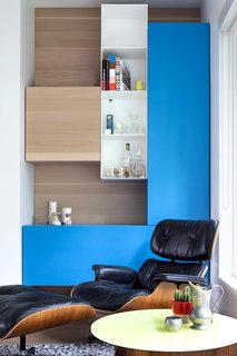 The modern floor plan and muted palette are interspersed with pops of color. 