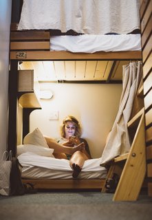 The wood-framed bunk beds come complete with a reading light and a privacy curtain.