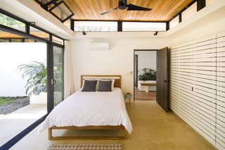 Decompress at This Boutique Hotel and Yoga Retreat in the Costa Rican Jungle - Photo 6 of 10 - Similar to the open spaces, the sleeping quarters have operable, sliding glass doors and clerestory windows that allow the tropical air to freely pass between the exterior and interior. 