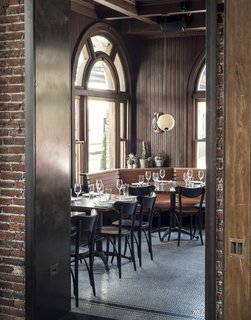 History and Modernity Meet in This Industrial Hotel and Restaurant in Philadelphia - Photo 10 of 11 - Simple pendant lighting, succulent greenery, and leather booths are simple, thoughtful elements that decorate the chic eatery. 