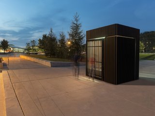 Toronto's Story Pod Doubles as a Lending Library and Community Hub - Photo 7 of 7 - Light shines through the slatted wall, providing illumination for nighttime gatherings and events. 