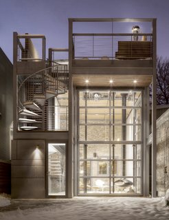 Here, the steel-and-glass addition is closed, protected from the winter cold. 