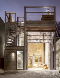 With the hangar door open, you can see the historic brick wall of the original house beyond. 